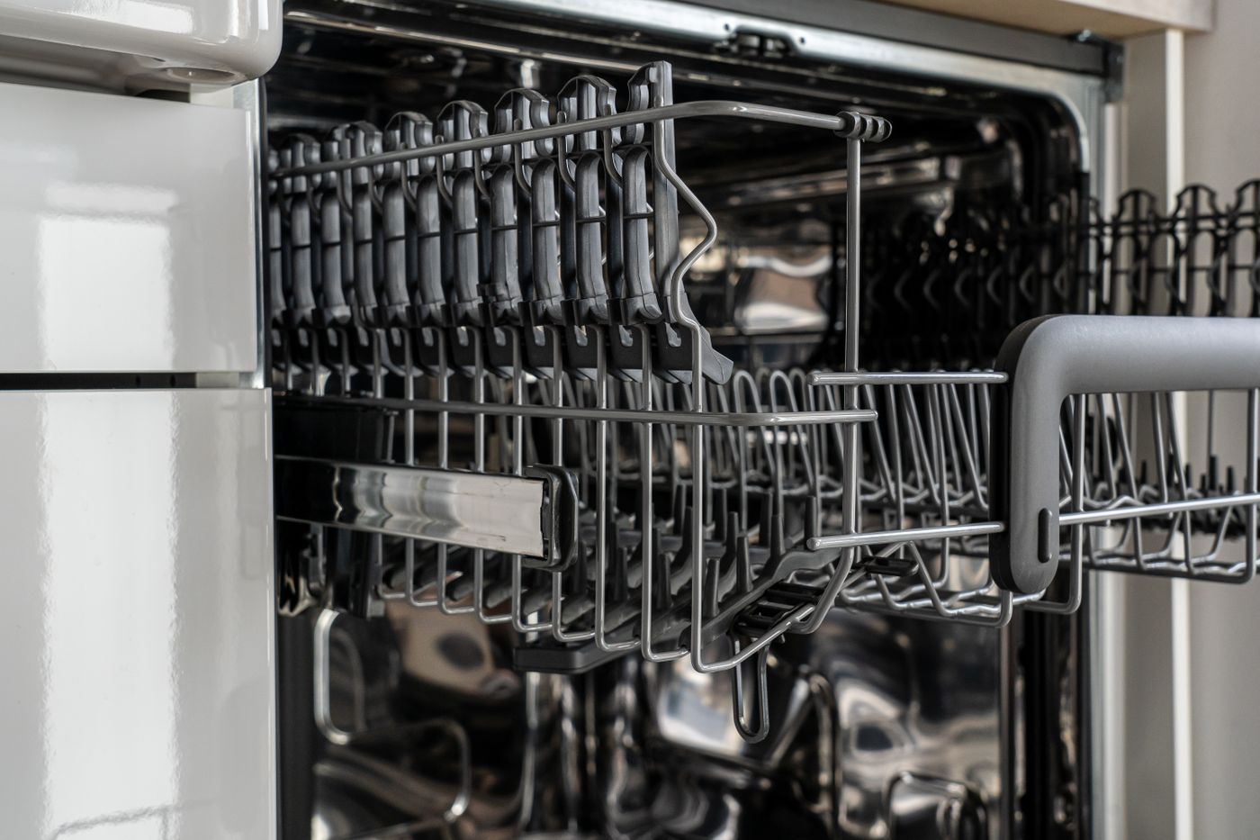 Close-up of empty dishwasher racks