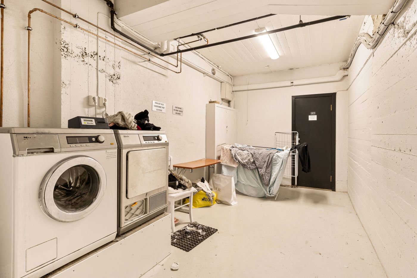Washer and dryer in a basement laundry room