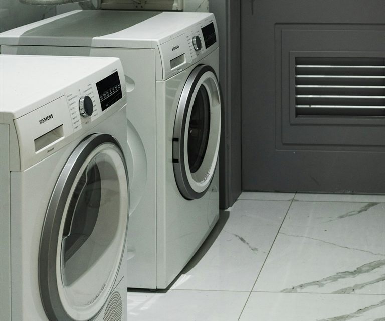 Front-load washer and dryer in a home laundry room